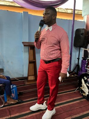 People carrying charity boxes during a community distribution event in Lagos.