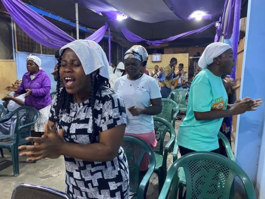 Volunteers distribute food boxes at the Lagos Food Bank Initiative, supporting local communities.