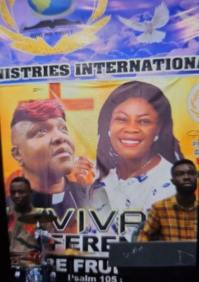 A group of men gather with food supplies in a rural outdoor setting.