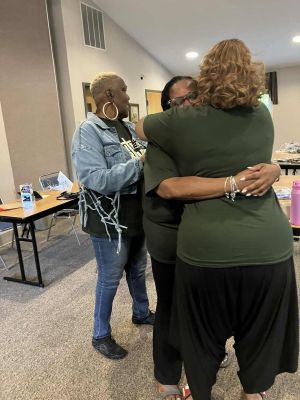 Young child washing hands in a rural area of Uganda, promoting hygiene awareness.